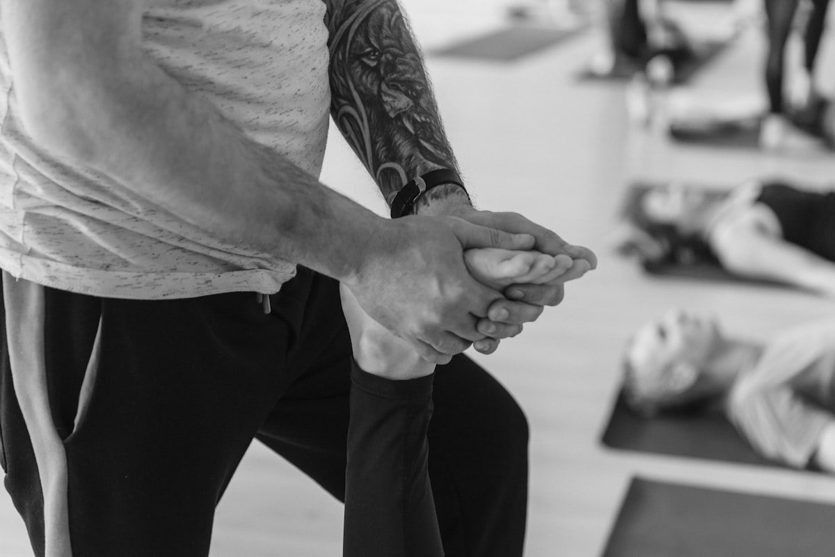 A runner stretching after exercise representing active joint health
